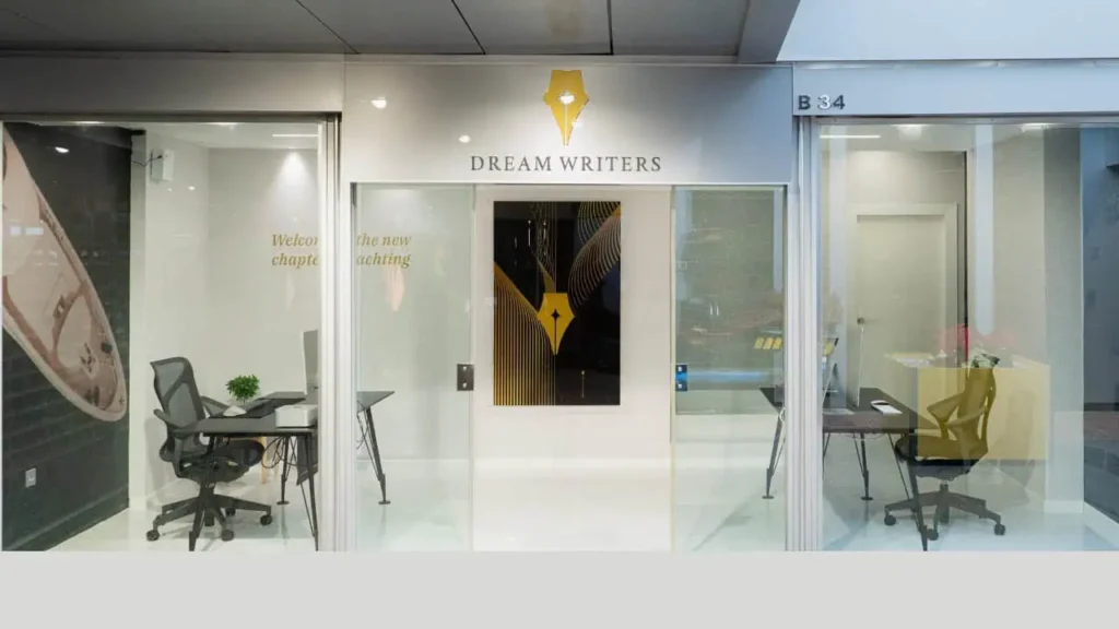Dream Writers office entrance with company logo and workspace inside